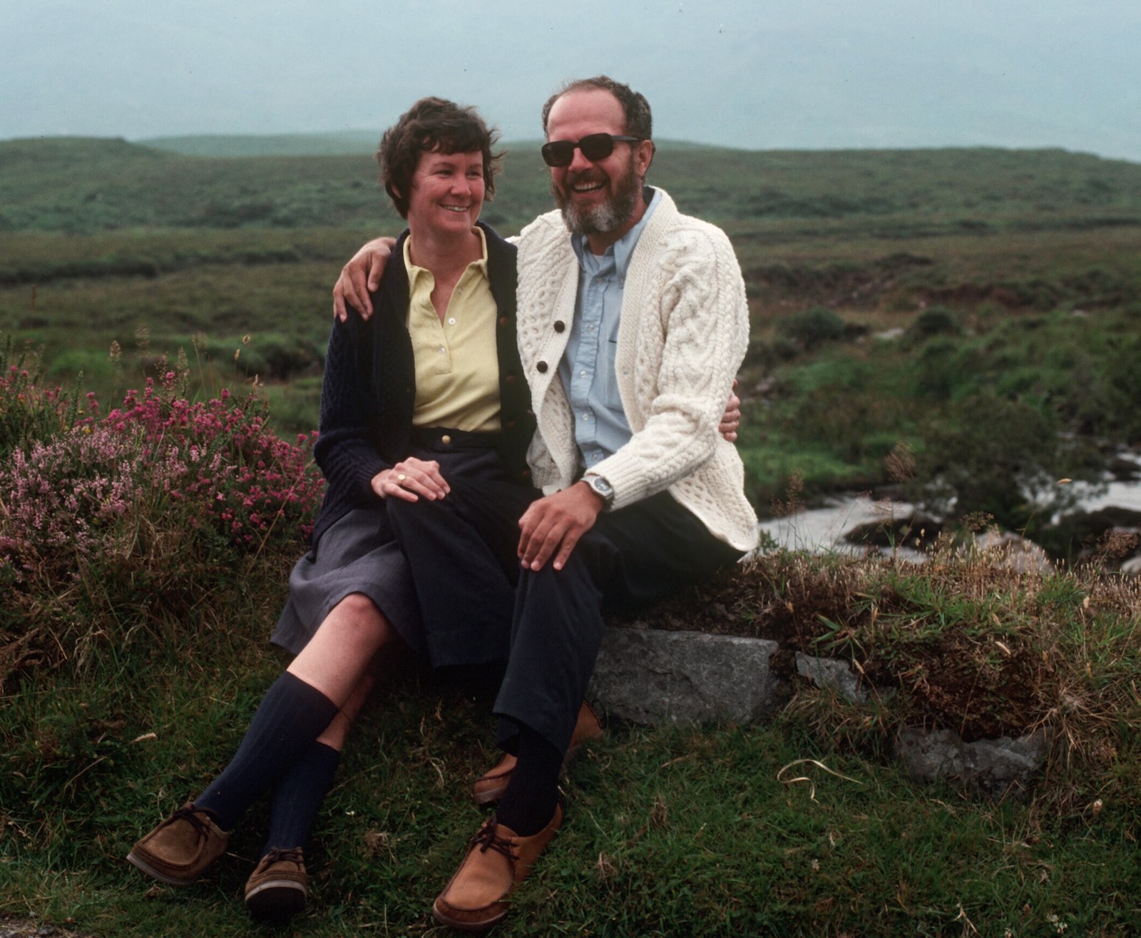 Bill and Judy Hunter in front of a green field